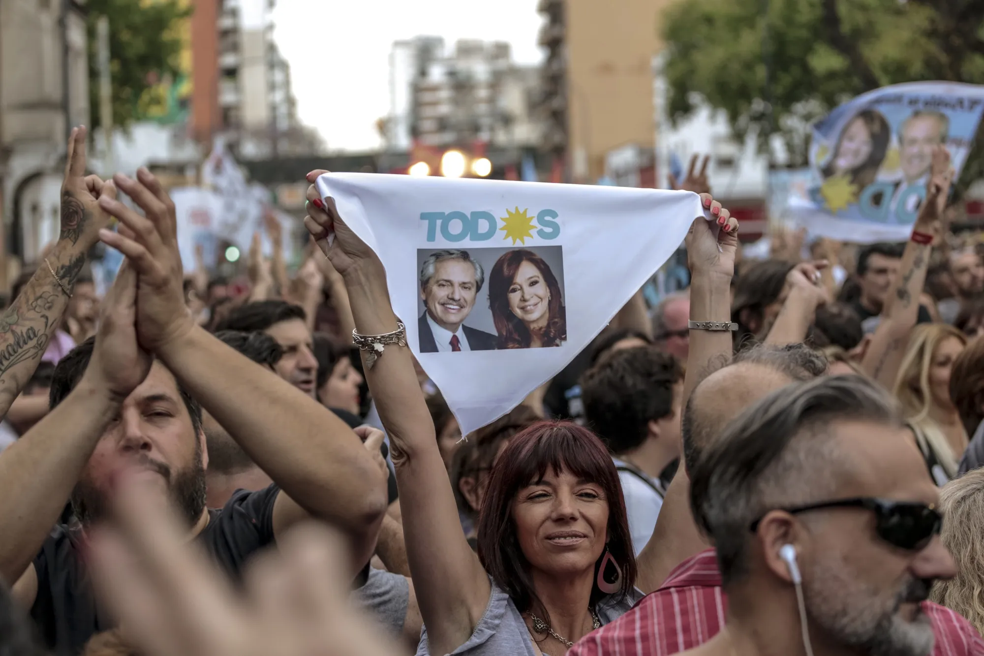 Attendees hold flags at the Frente de Todos party headquarters during an election&nbsp;rally in&nbsp;Buenos Aires on Oct. 27.