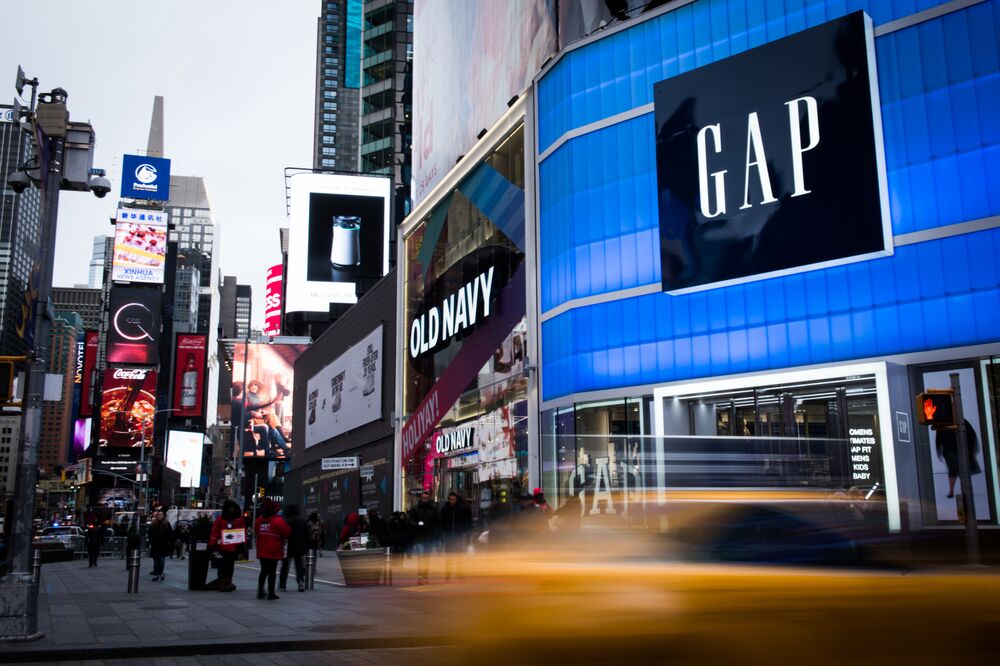 Gap Gps Tesla Tsla Stocks Lead Retail Closures Bloomberg Pedestrians P In Front Of Gap Inc And Old Navy S The