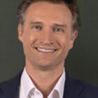 Headshot of Dolf van den Brink