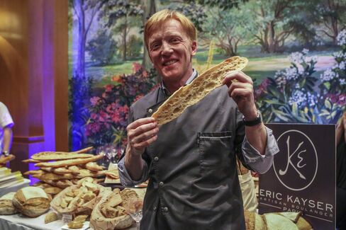 Eric Kayser, winner of the contest, displays what is henceforth known as the "Best Baguette in NYC."