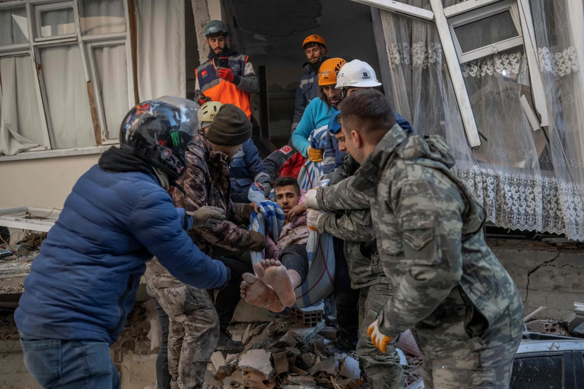A man is rescued after being stuck in rubble for two days in Hatay, southeastern Turkey, on Feb. 8.