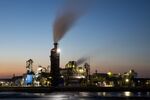 Emissions rise from the Daesung Wood Industrial Co. factory at dusk in Incheon, South Korea.