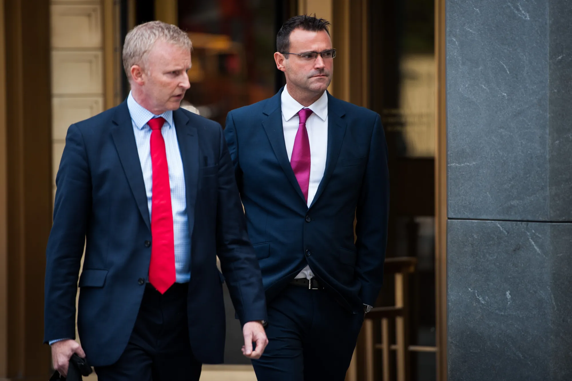 Richard Usher, right, leaves federal court on July 17, 2017.