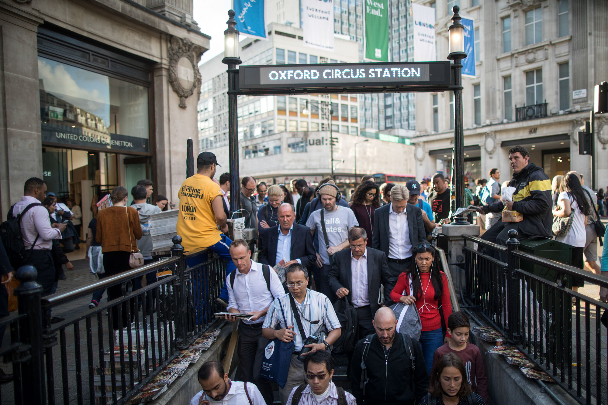 A crowd of pedestrians enter the stairs leading to London Underground metro station at Oxford Circus in 2017.&nbsp;