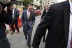 Budget director Mick Mulvaney (center) walks back to the White House from the Consumer Financial Protection Bureau building in Washington after he showed up for his first day of work as the CFPB’s acting director on Nov. 27.