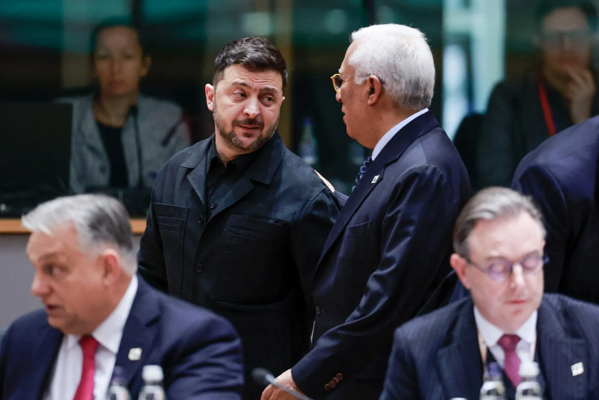Volodymyr Zelenskiy, center, at the EU summit in Brussels on Dec. 18.