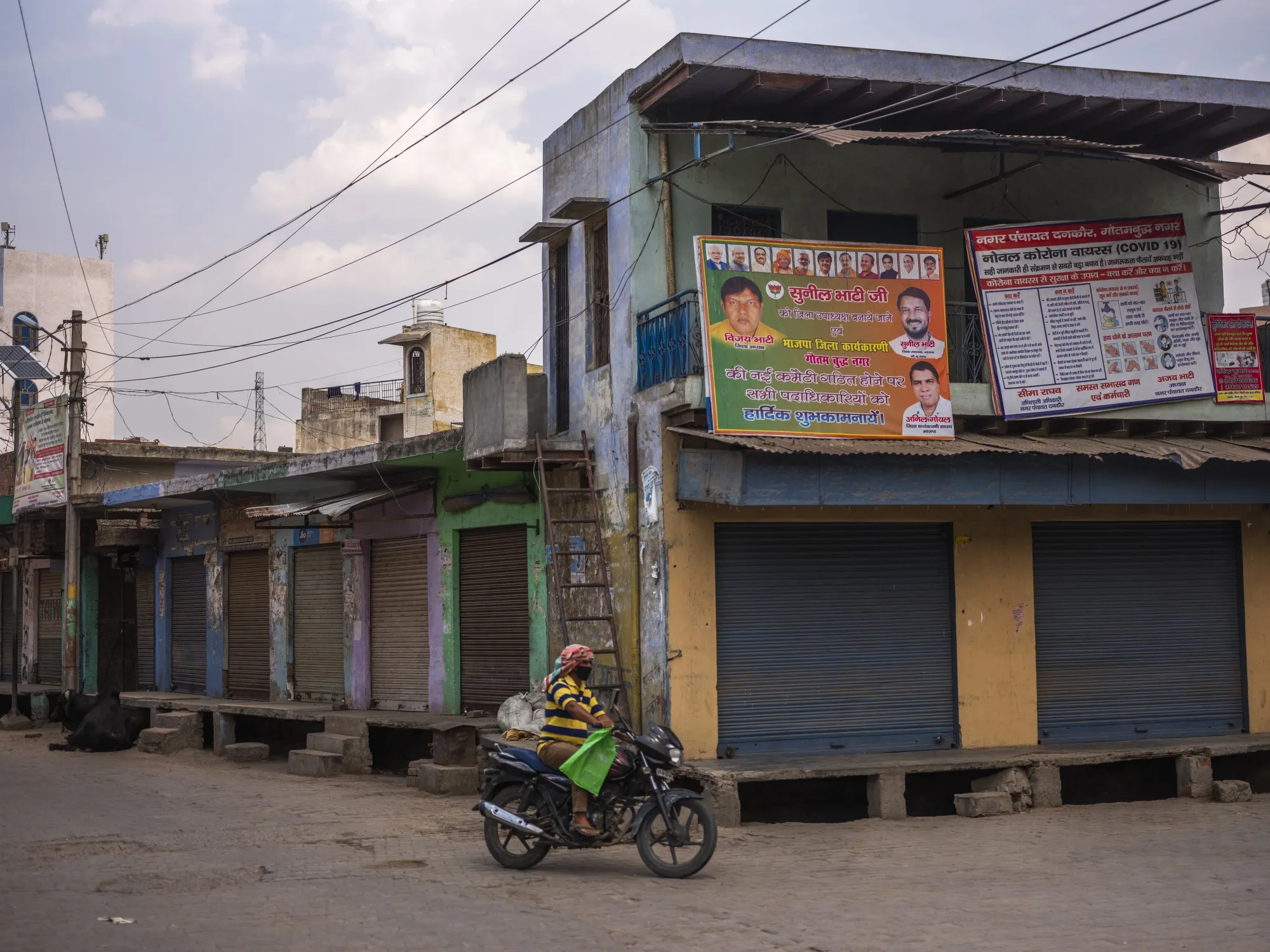 A motorcyclist travels during a partial lockdown&nbsp;in the Gautam Buddh Nagar district of Uttar Pradesh, on April 21.