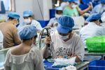 Workers on the production line at a toy factory in Shenzhen, China.