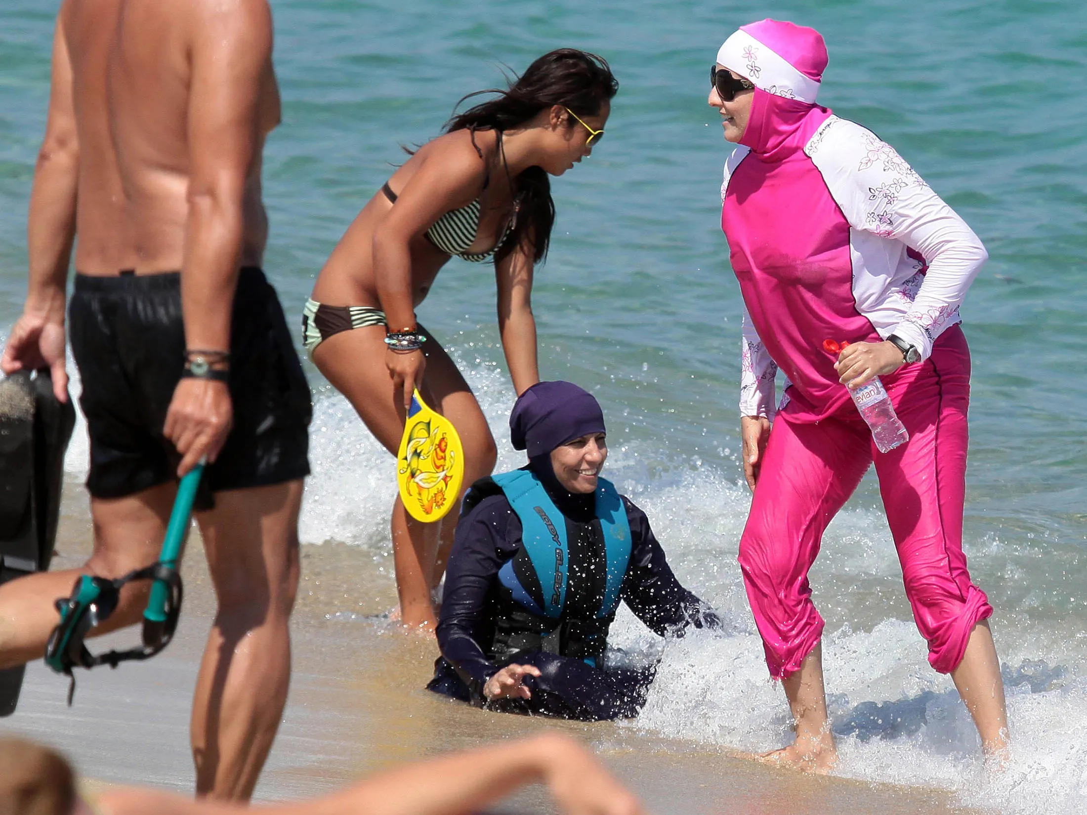 A woman wearing a burkini takes a dip in south of France on Aug. 15, 2016.
