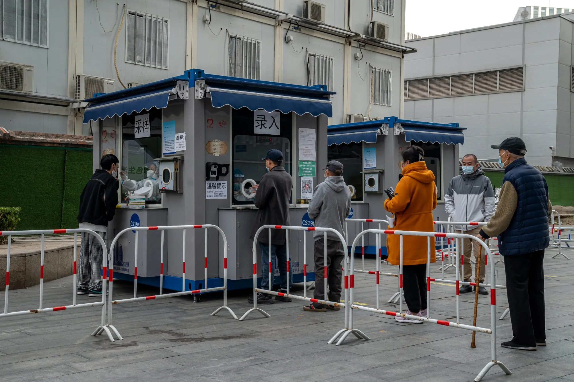 Residents at a Covid-19 testing station in Beijing on Oct. 12.