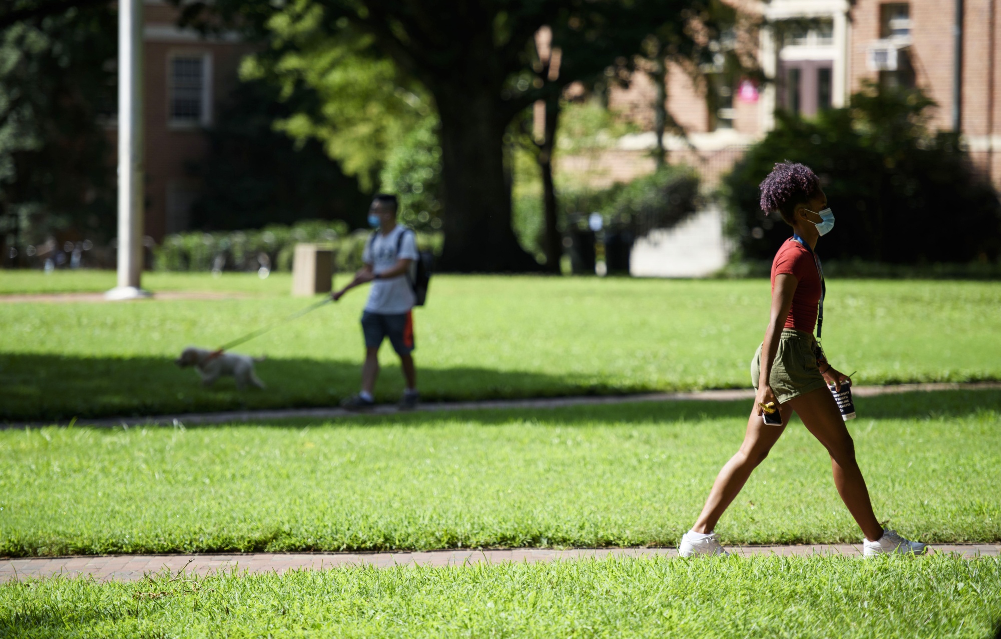 Students walk through the campus of the University of North Carolina at Chapel Hill on Aug. 18. The school halted in-person classes and reverted back to online courses after several Covid-19 outbreaks.&nbsp;
