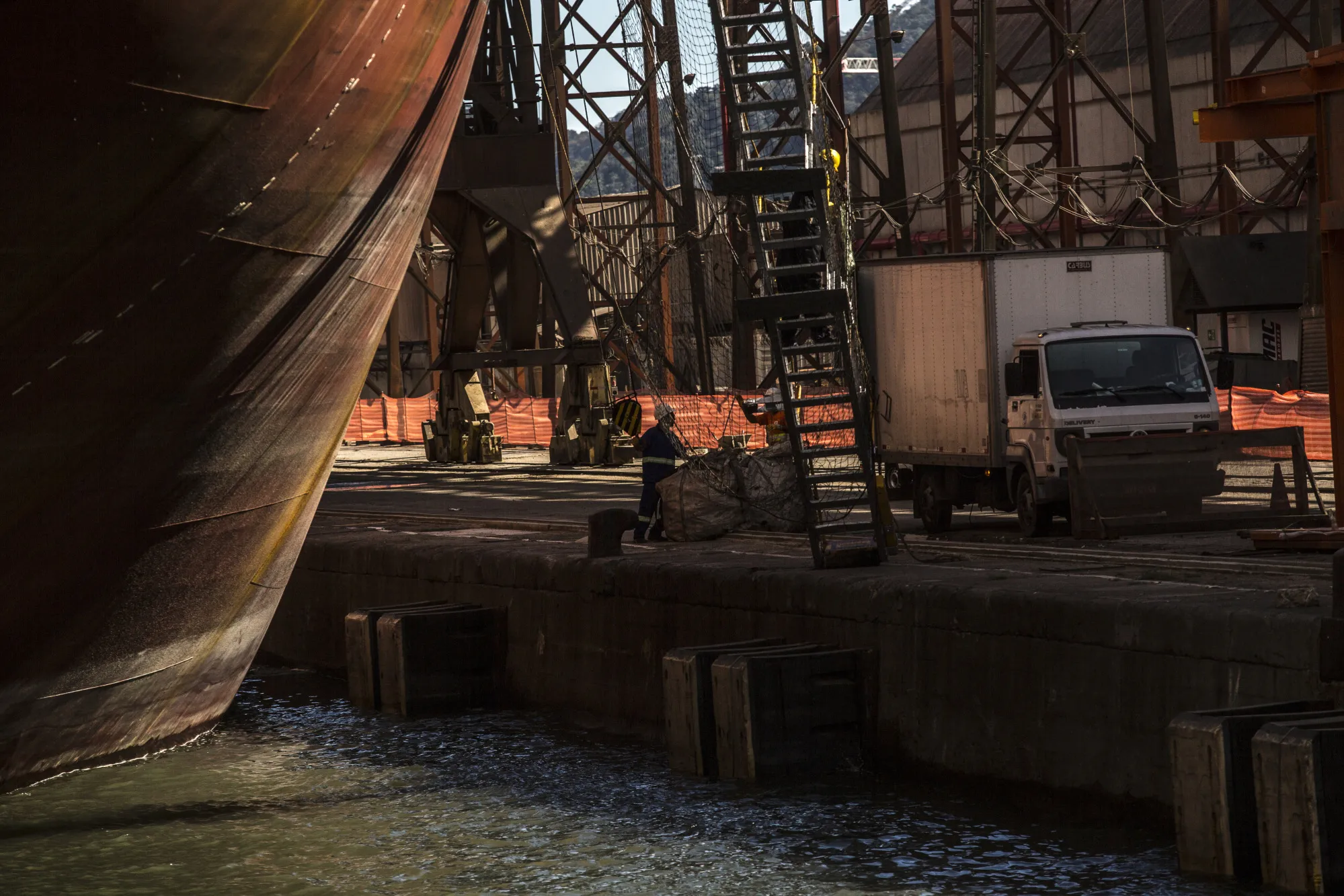 Workers move bags on a dock at the Port of Santos in Santos, Brazil in 2017.