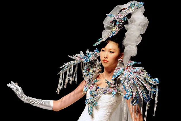 A model presents a wedding dress collection at China Fashion Week in Beijing on October 29, 2010