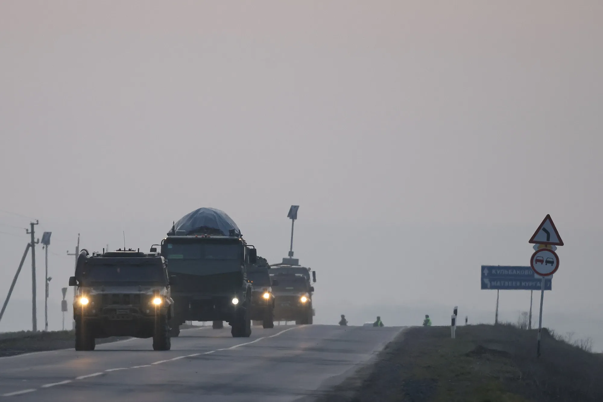 A convoy of Russian military vehicles move towards border in Donbas region of eastern Ukraine on Feb. 23.