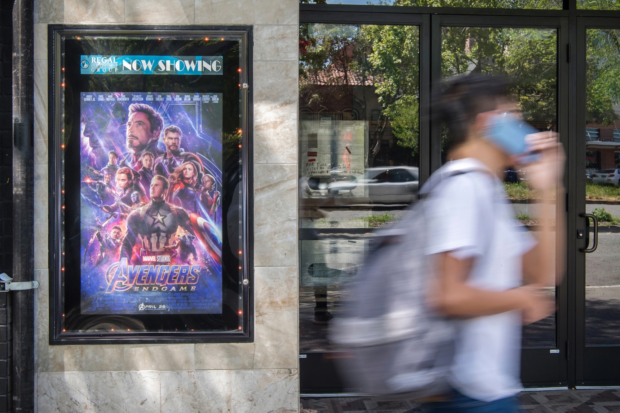 A pedestrian walks past an &quot;Avengers: Endgame&quot; poster in Berkeley, California.