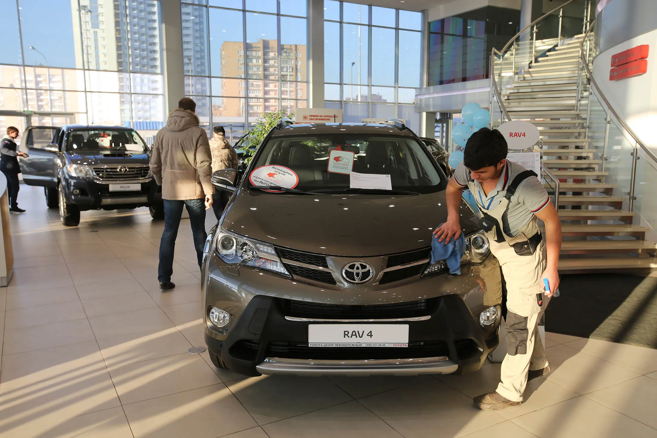 An employee cleans a Toyota RAV4 vehicle at a showroom in Moscow. RAV4 owners will be notified by mail of the recall.

