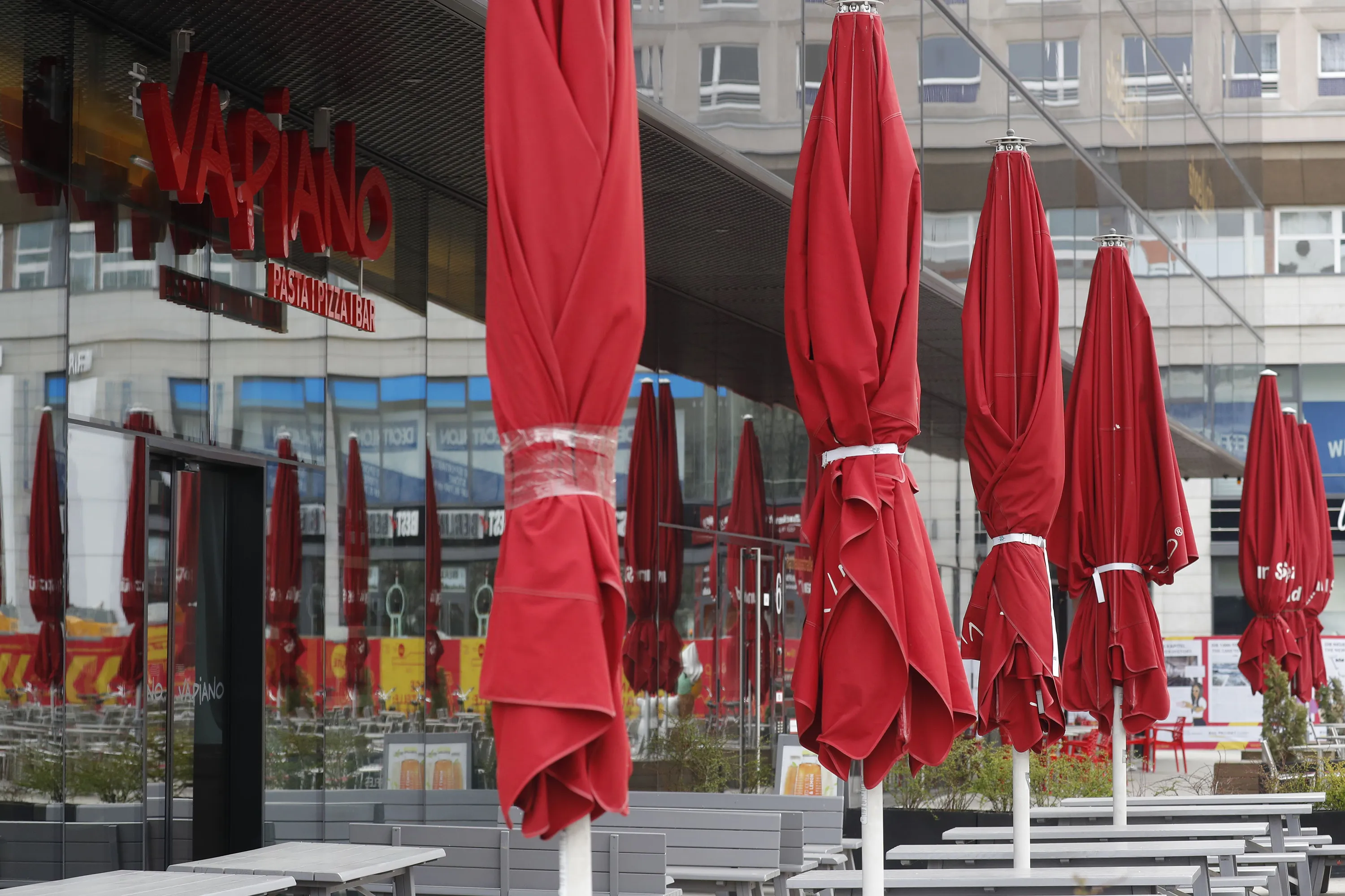 Closed sunshades stand in front of a restaurant of the chain Vapiano in Berlin, on April 2.