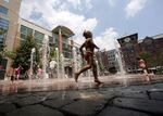 Children play in Rockville Town Square in Rockville, Maryland, a suburb of Washington, D.C.