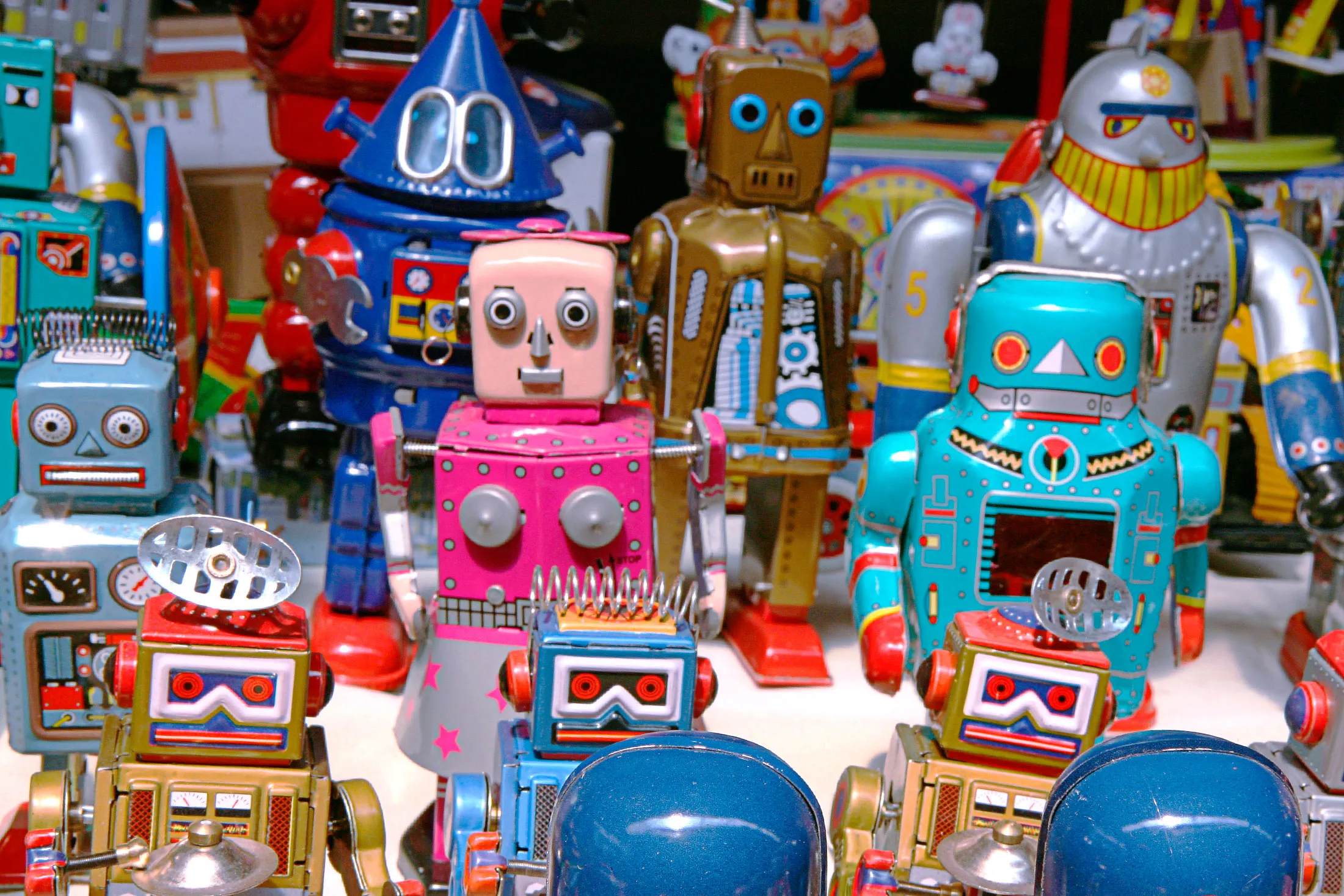 China, Beijing, Panjiayuan Antique Market, robot and soldier toys for sale at market stall
