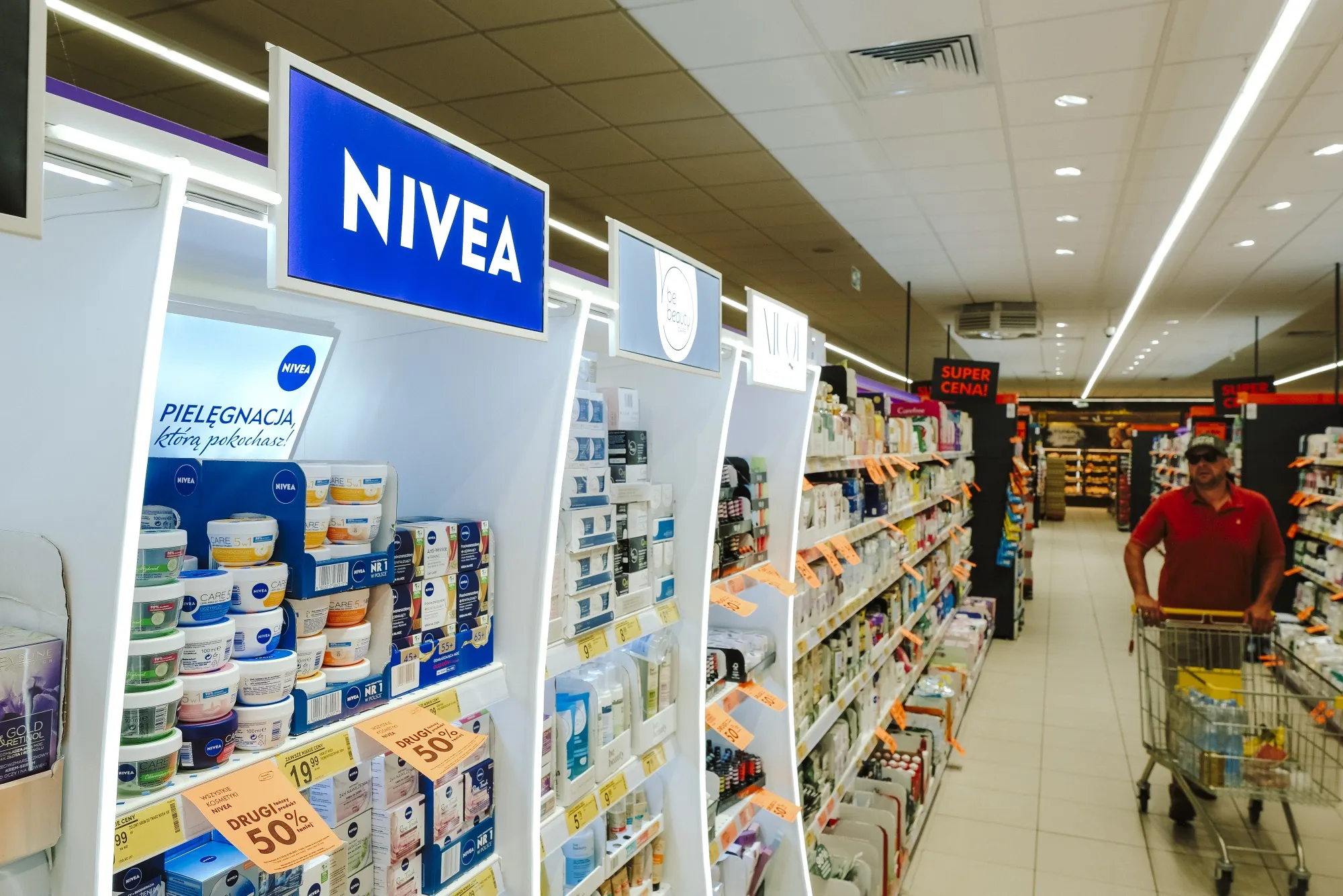 A display of Nivea cosmetic products inside a supermarket in Warsaw.