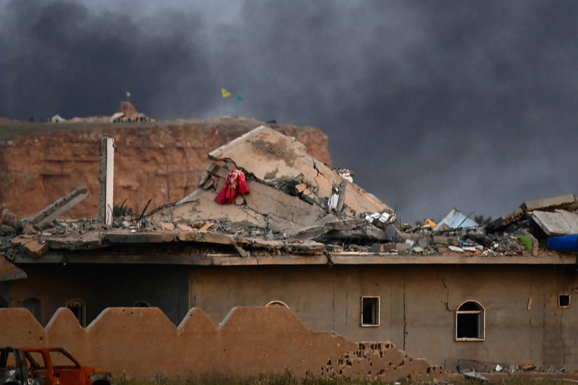 Smoke rises over the village of Baghouz on March 22