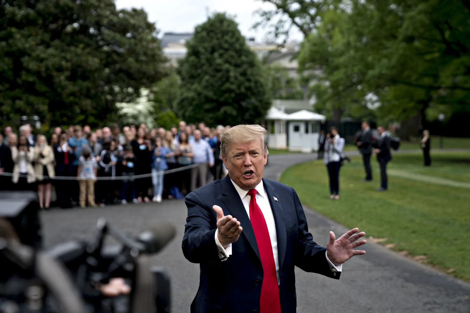 U.S. President Donald Trump speaks members of the media before boarding Marine One on the South Lawn of the White House in Washington, D.C., U.S., on Friday, April 26, 2019.