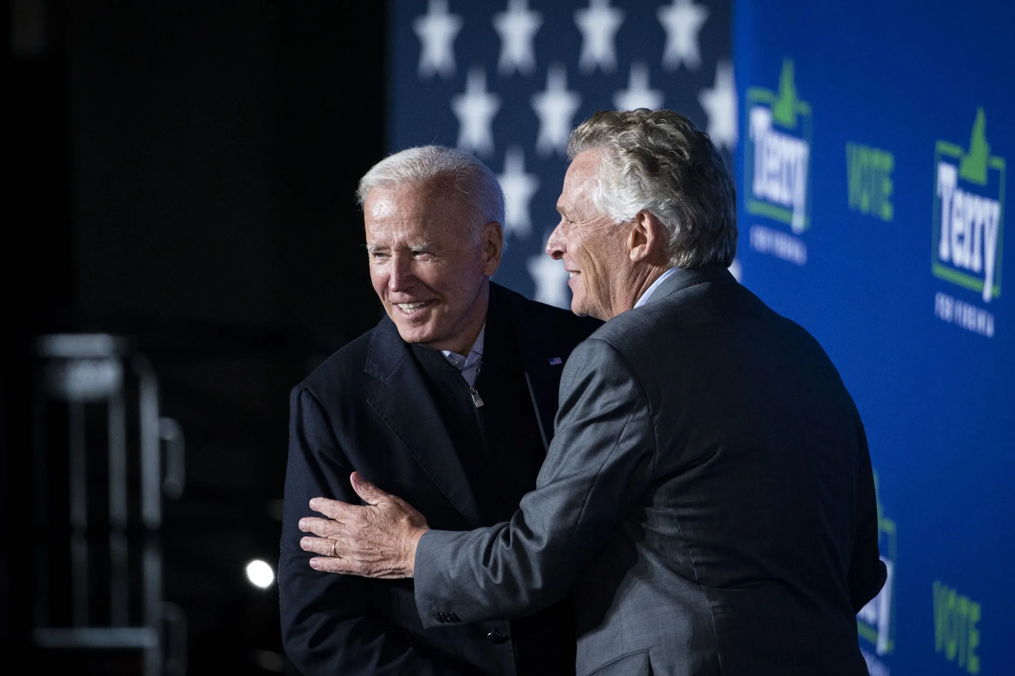 Joe Biden, left, greets Terry McAuliffe during a campaign event in Arlington, Virginia, U.S., on Oct. 26.
