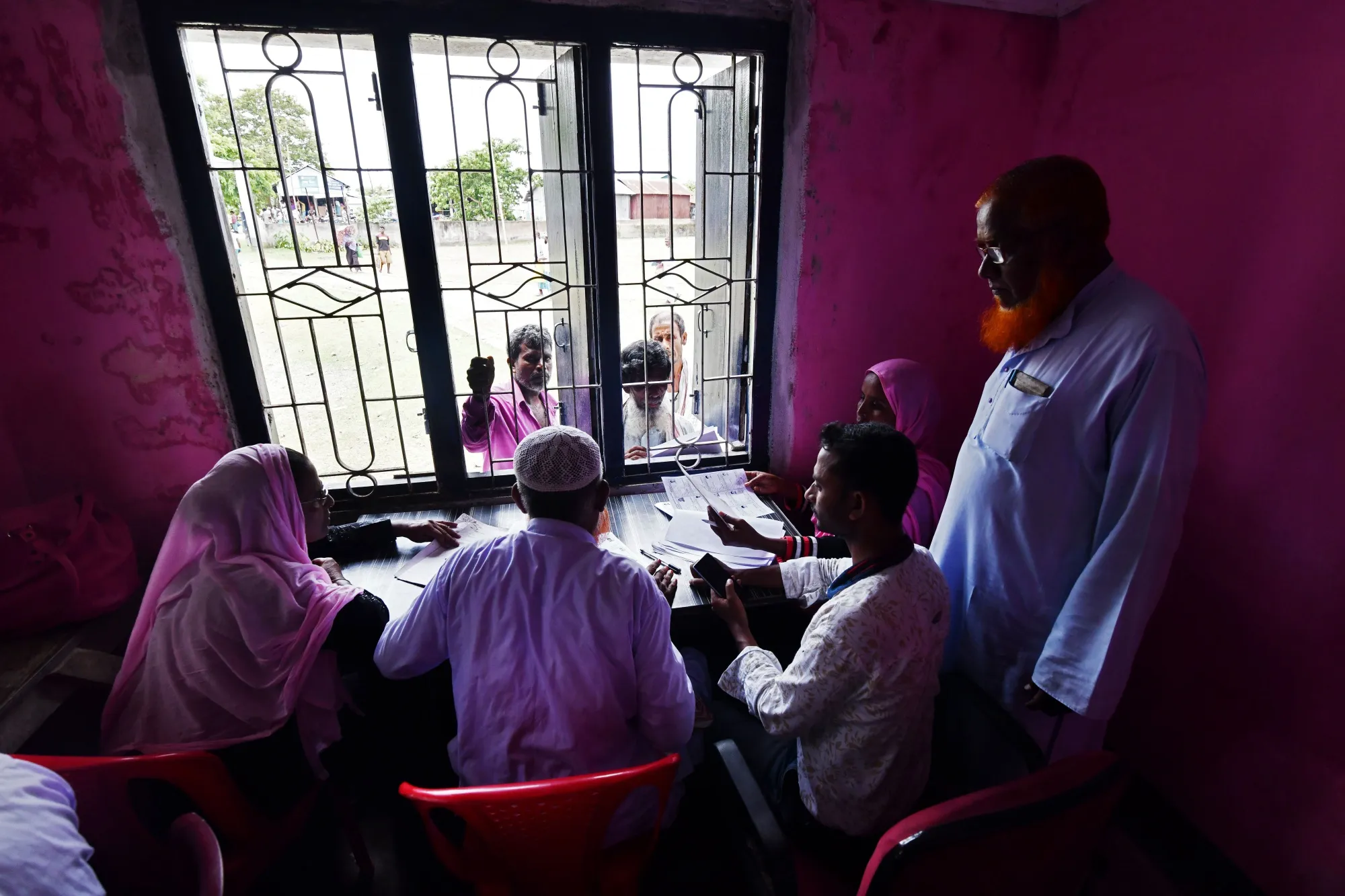 People check their names on the final list of the National Register of Citizens in Assam on Aug. 31.