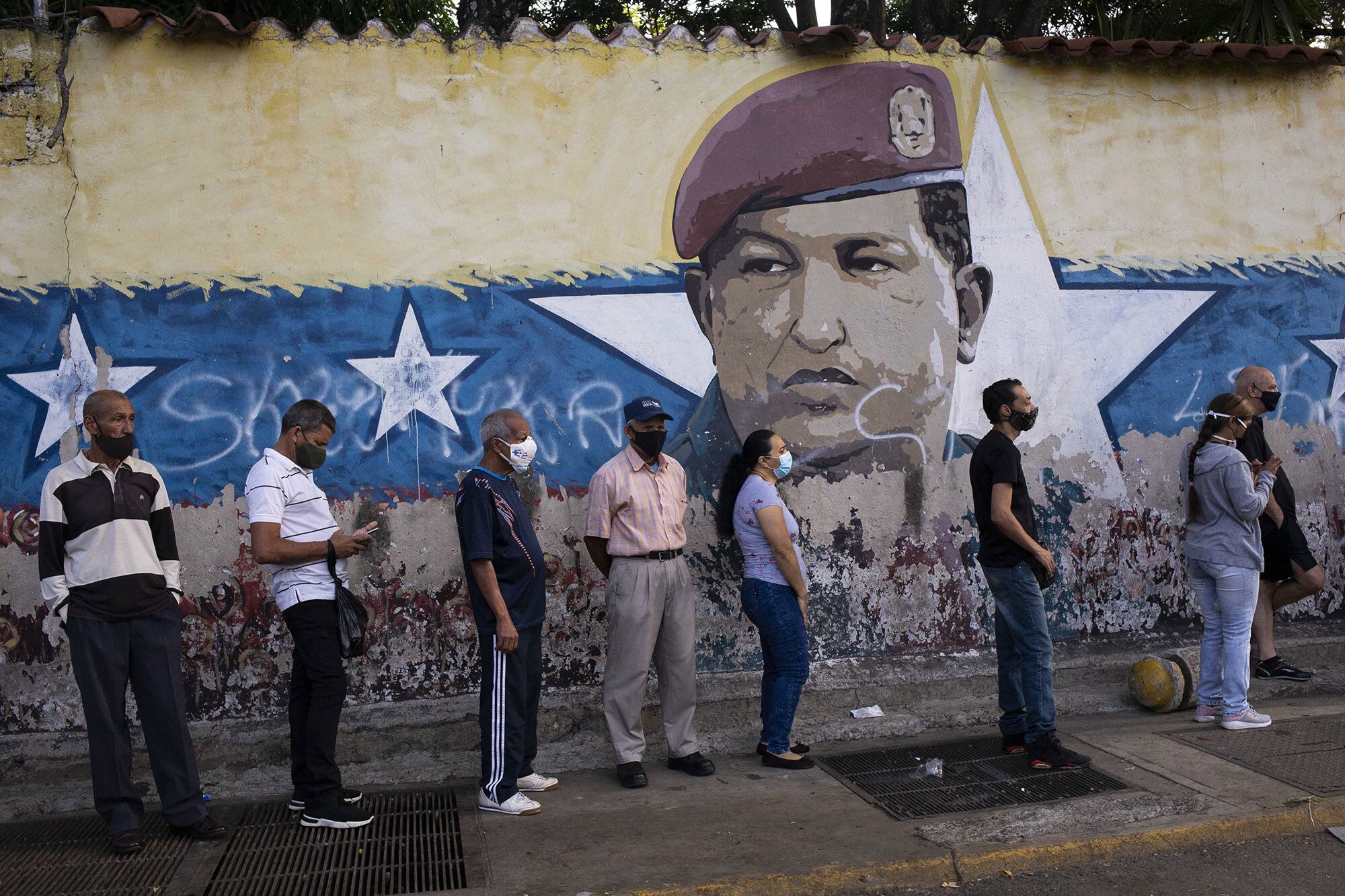 People queue at a polling station in Caracas, on Nov. 21. 