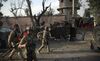 Afghan security personnel gather in front of the prison after an attack in the city of Jalalabad, east of Kabul, on Aug. 3.