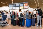 Queues of passengers in the departure hall at Charles de Gaulle airport in Paris, on July 2.