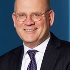 Headshot of John L Flannery