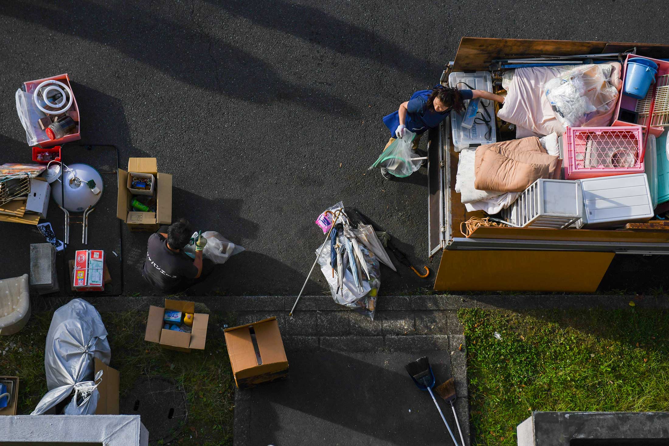 Staff from Tail Project organize cleaned-out belongings.