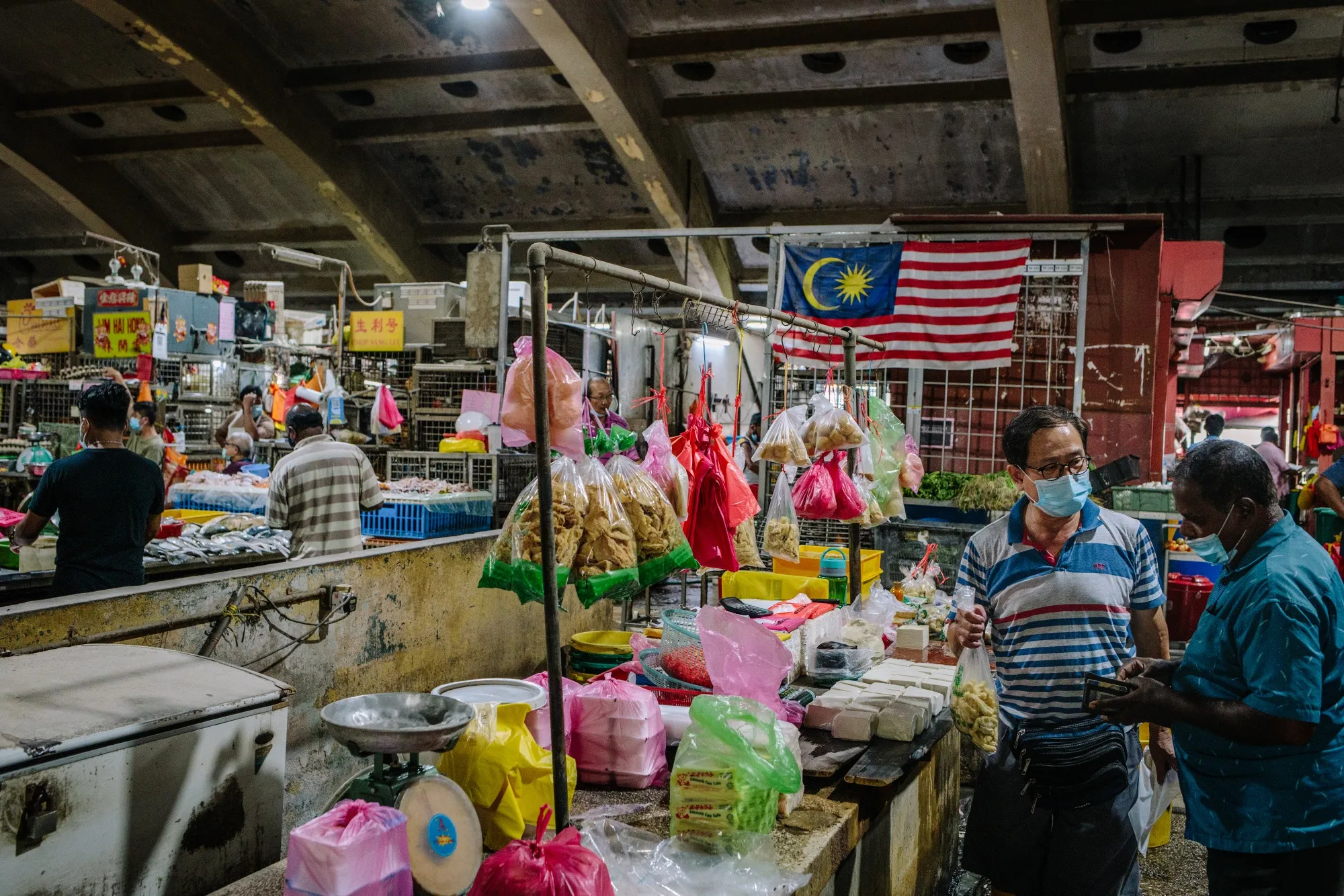 Shoppers at a market in Kuala Lumpur.