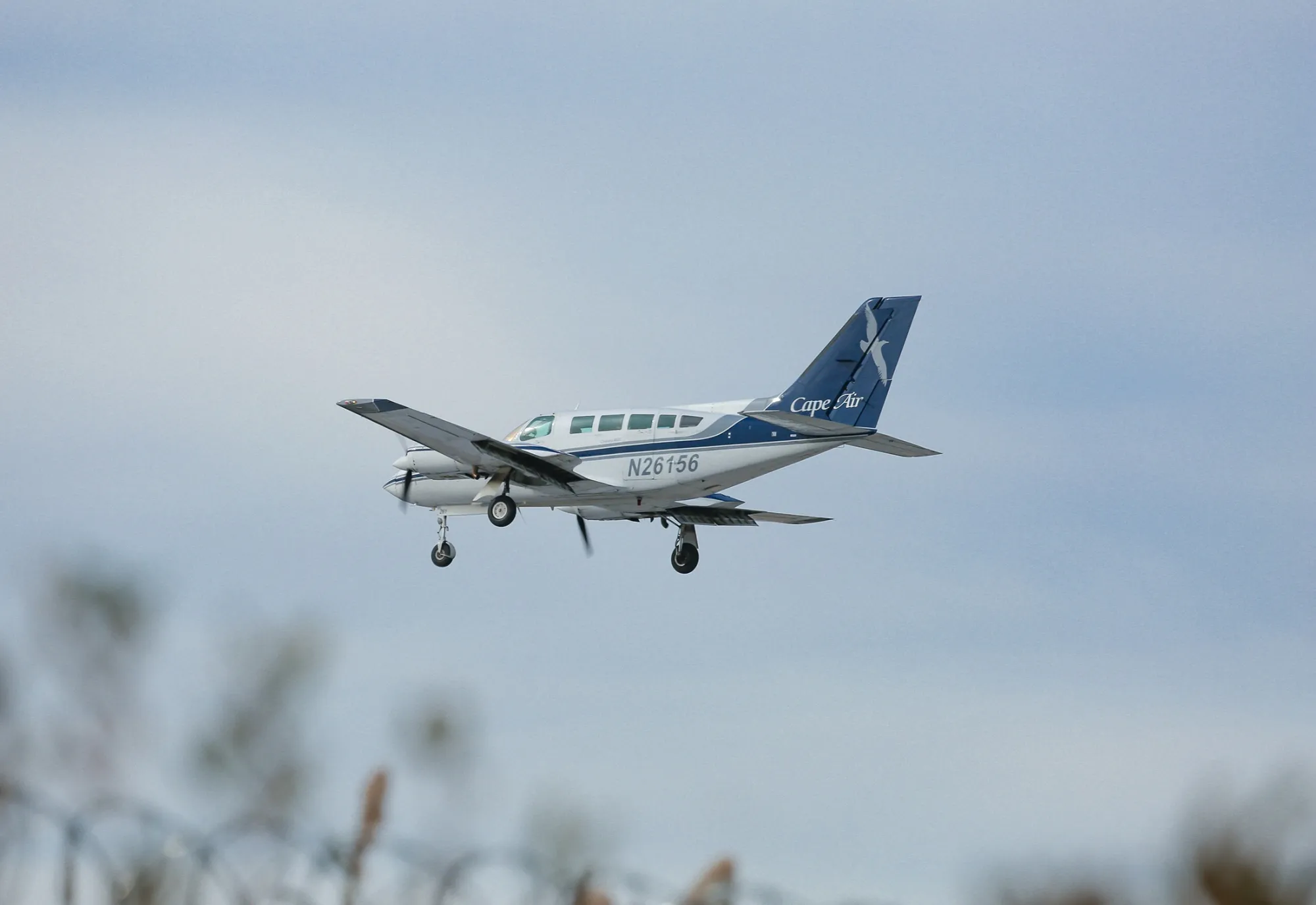 A Cape Air Cessna 402 aircraft prepares to land at JFK Airport.