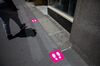 Social distancing markers are displayed in front of a T-Mobile US Inc. store in New York, U.S..