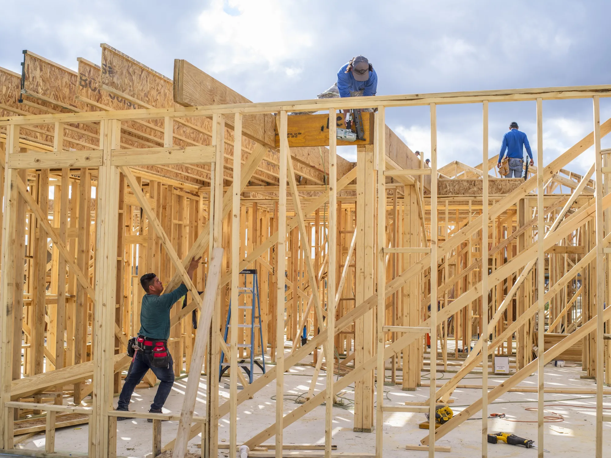 Construction workers frame a new home being built by CastleRock Communities in the Sunfield neighborhood of Buda, Texas, U.S., on Wednesday, Nov. 10, 2021.&nbsp;