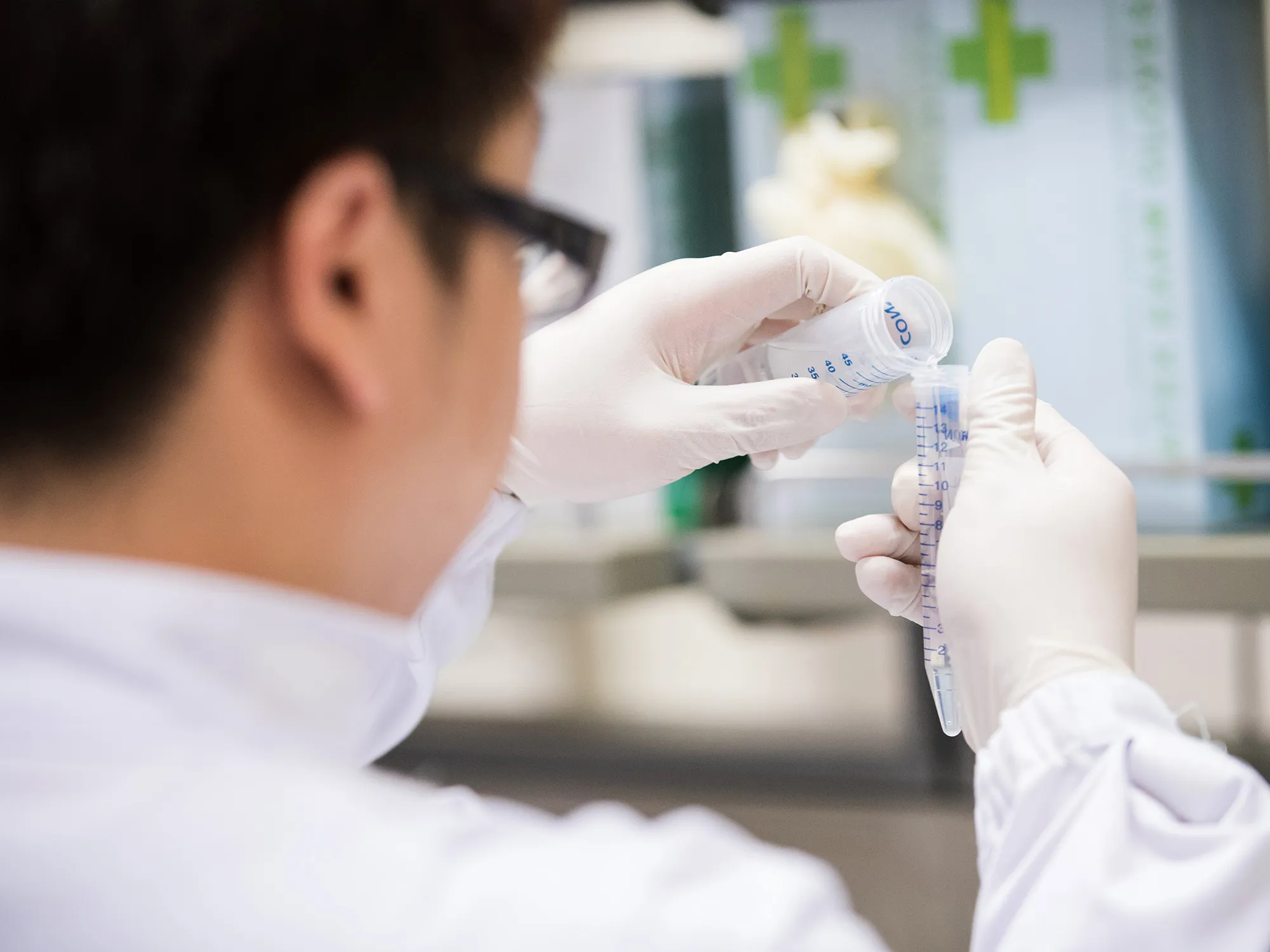 A researcher performs tests in a lab.
