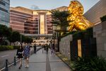 Pedestrians pass the Wynn Macau casino resort in Macau, on Oct. 5.