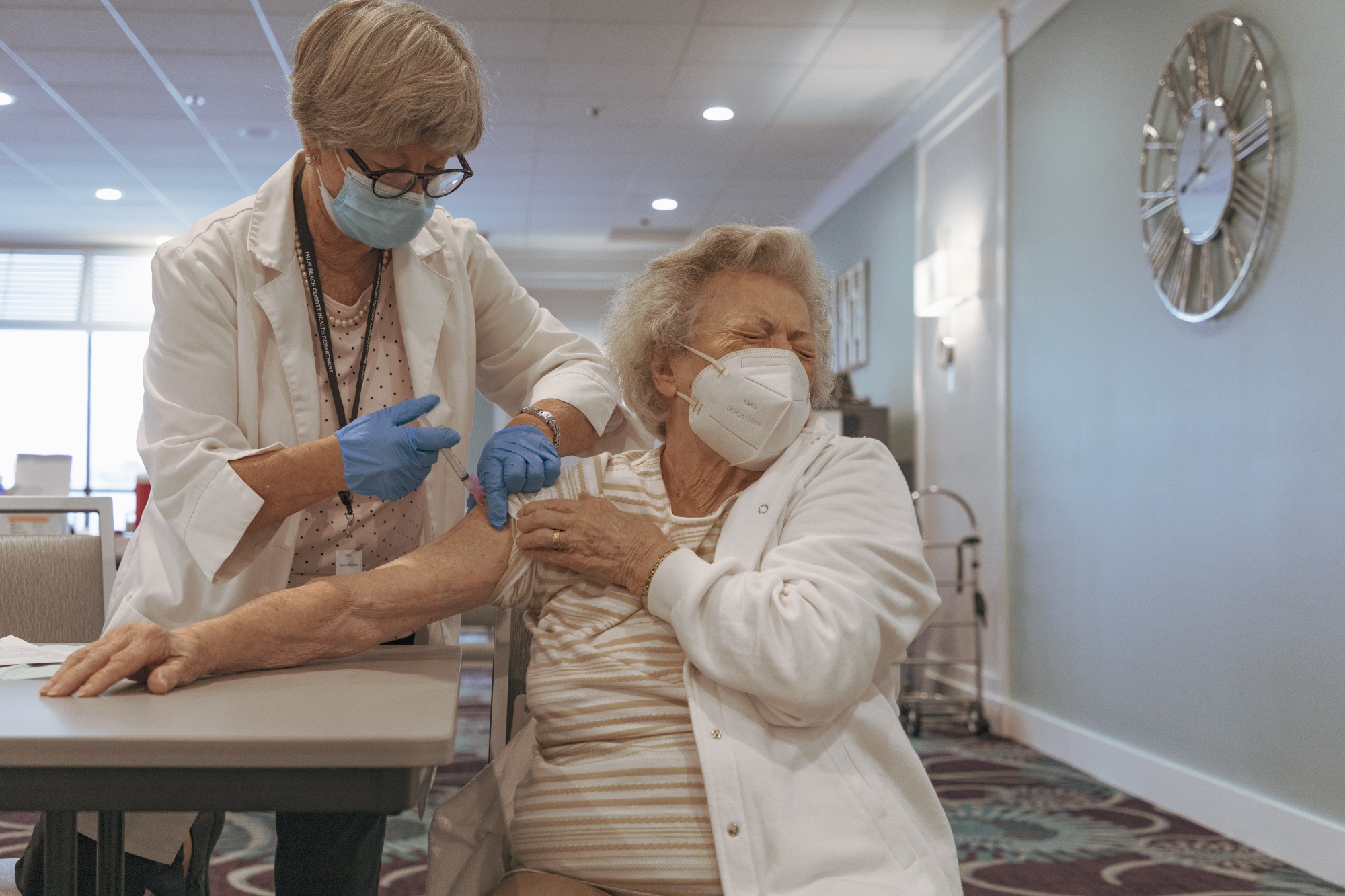 A resident receives the Moderna Covid-19 vaccine at a retirement home in Delray Beach, Florida, on December 30.