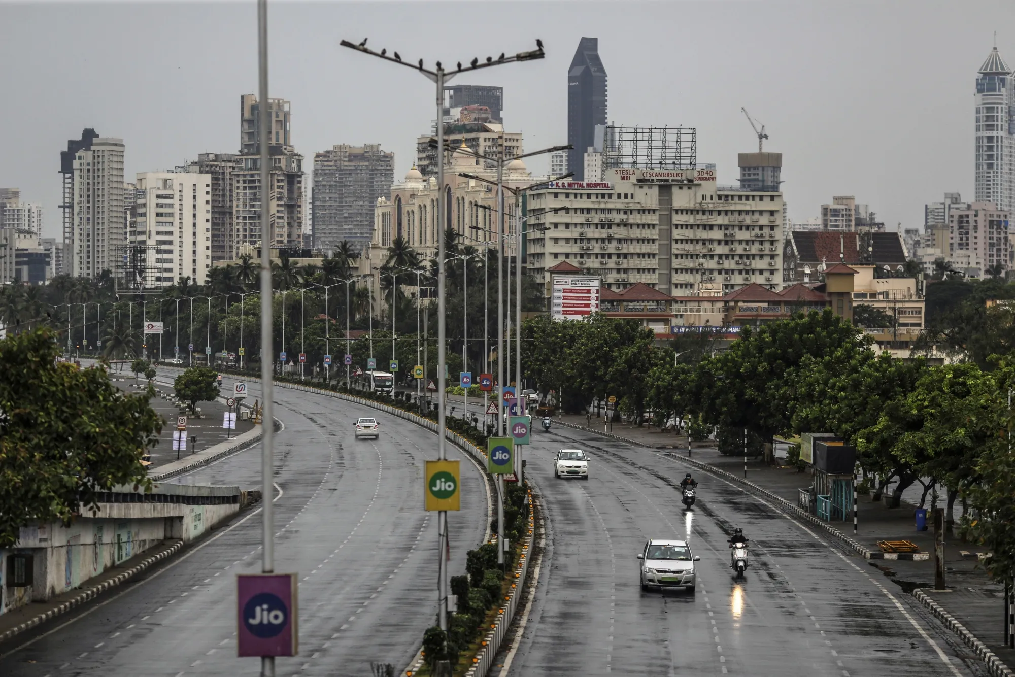 Vehicles travel along an empty Marine Drive during a lockdown imposed due to the coronavirus in Mumbai, India, on Monday, June 1.&nbsp;