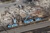 Pacific Gas & Electric Co. (PG&E) employees work to fix downed power lines burned by wildfires in this aerial photograph taken above Santa Rosa, California, on Oct. 12, 2017. 