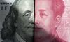 Banknotes of US Dollar and RMB are arranged for photography