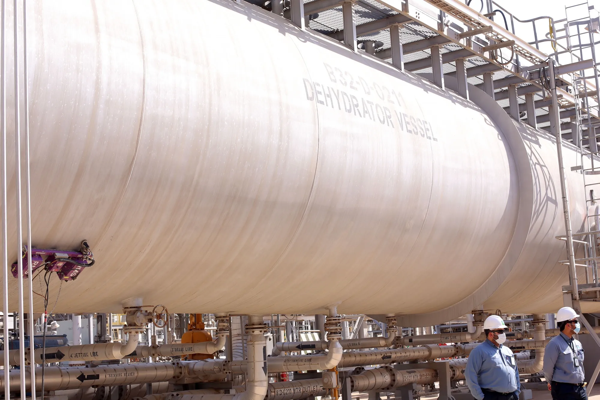 Saudi Arabian Oil Co. workers in the Khurais oil field.