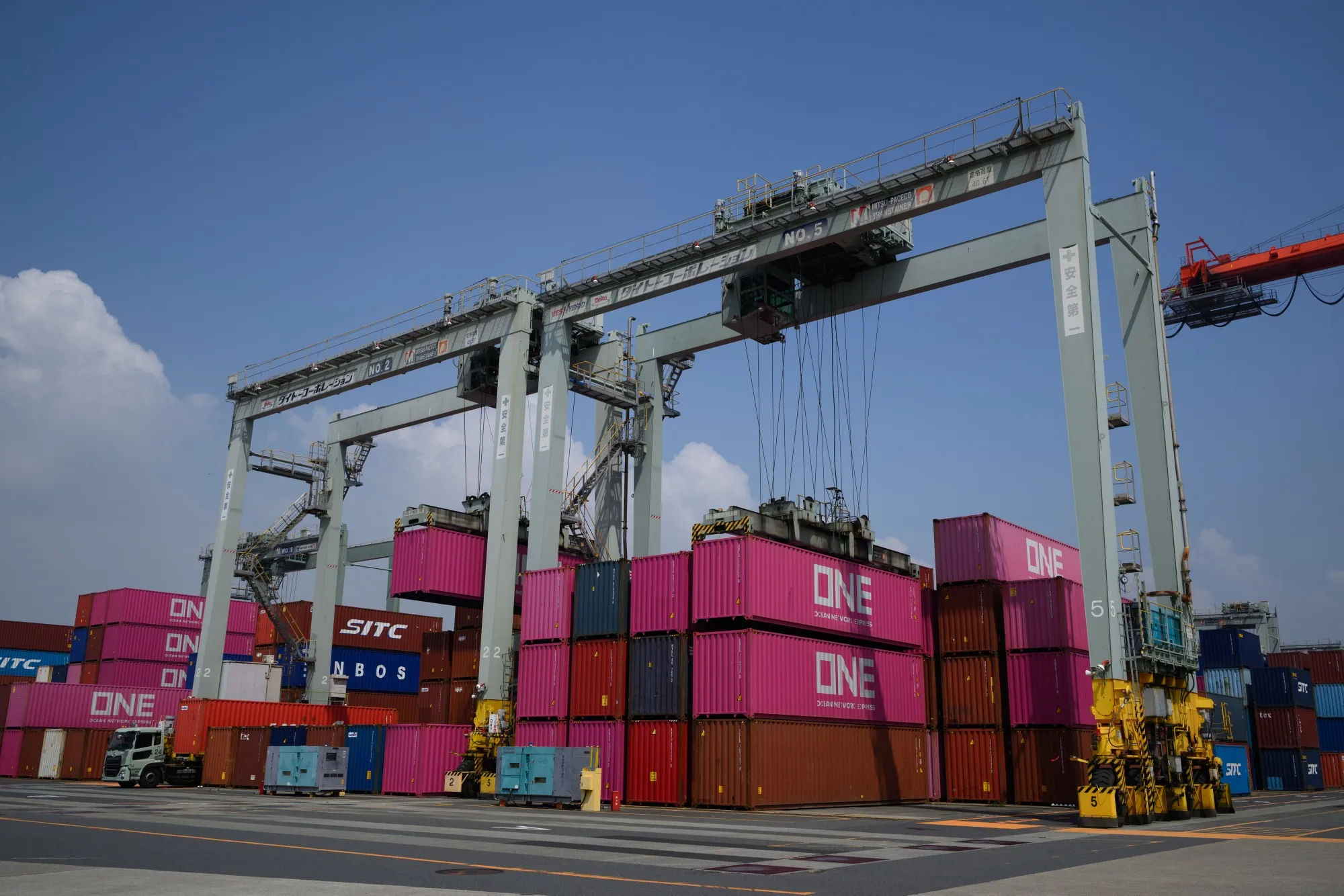A gantry crane unloads shipping containers at the Oi Container Terminal in Tokyo, Japan