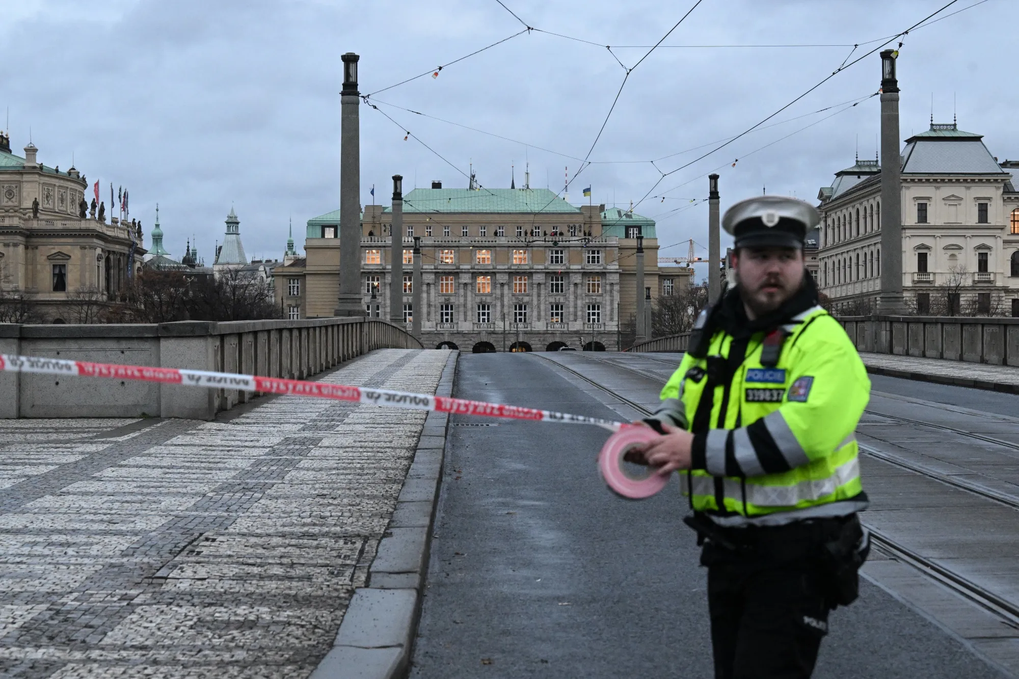 A police officer cordon off an area near the university in Prague, on Dec. 21.