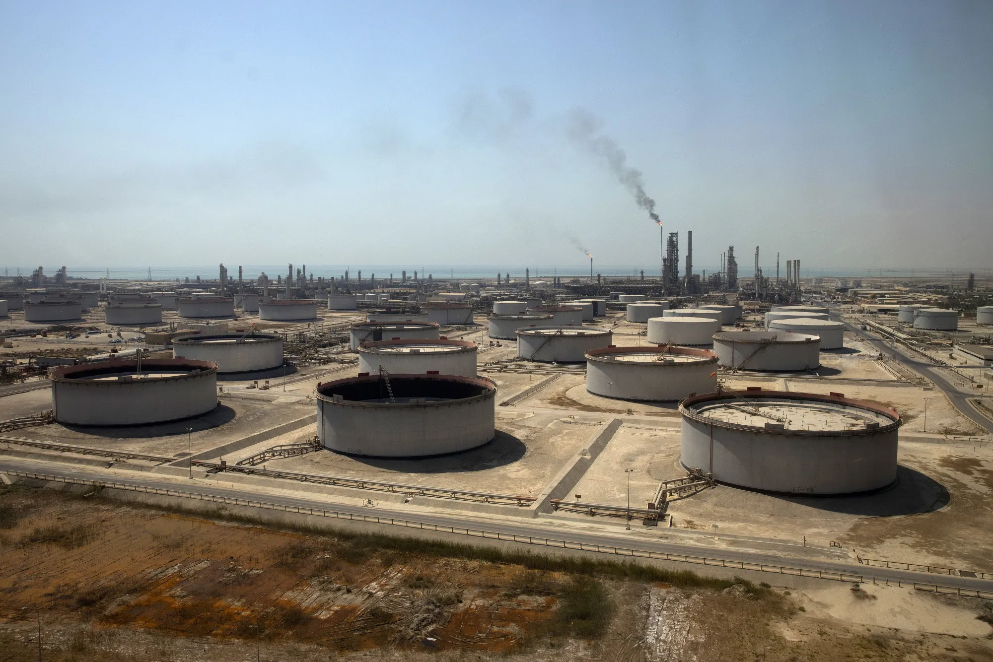 Crude oil storage tanks at an oil refinery and oil terminal in Ras Tanura, Saudi Arabia.