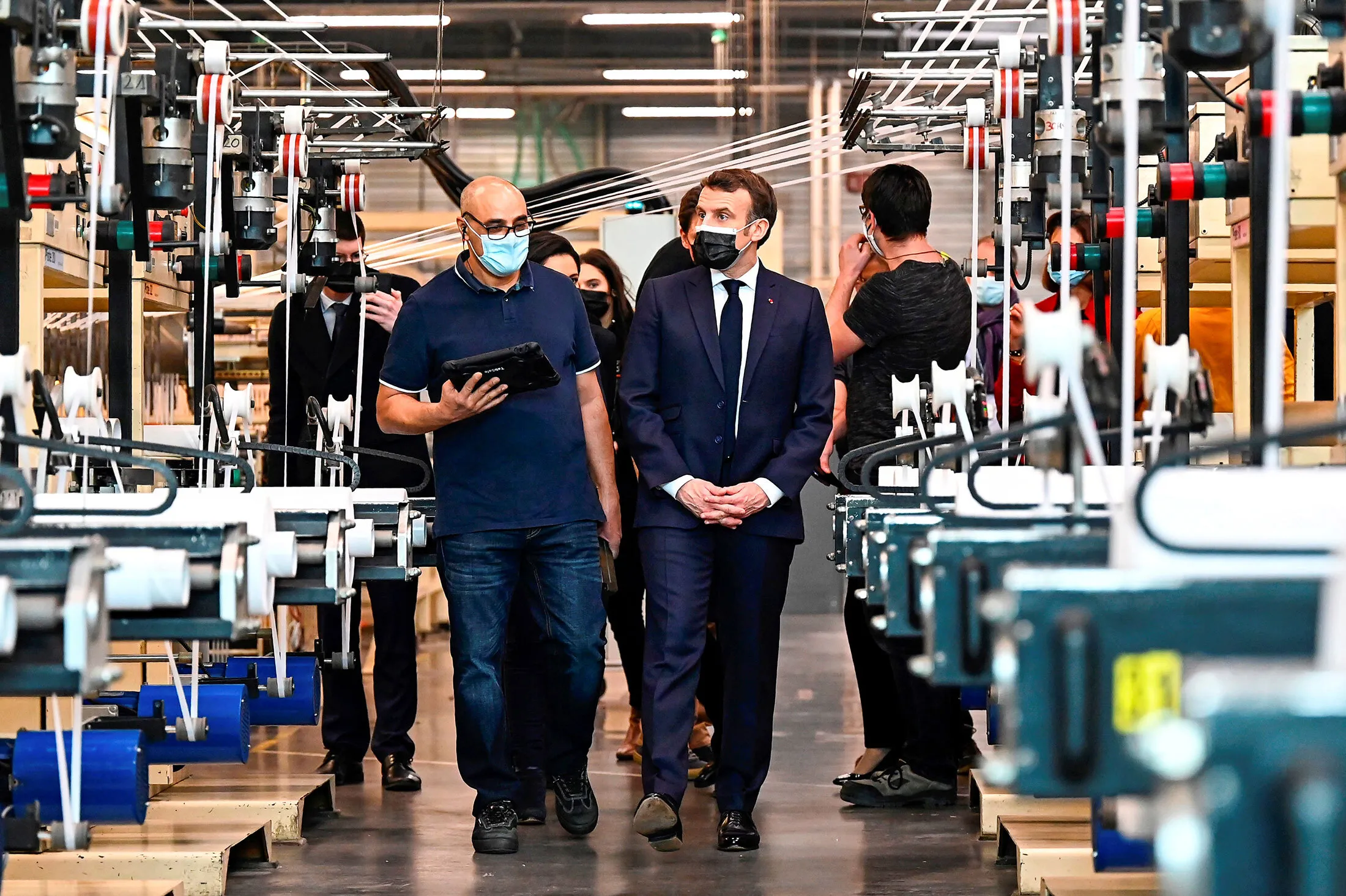 President Emmanuel Macron tours an Aplix&nbsp;factory in&nbsp;Le Cellier, France, on Feb. 11.&nbsp;