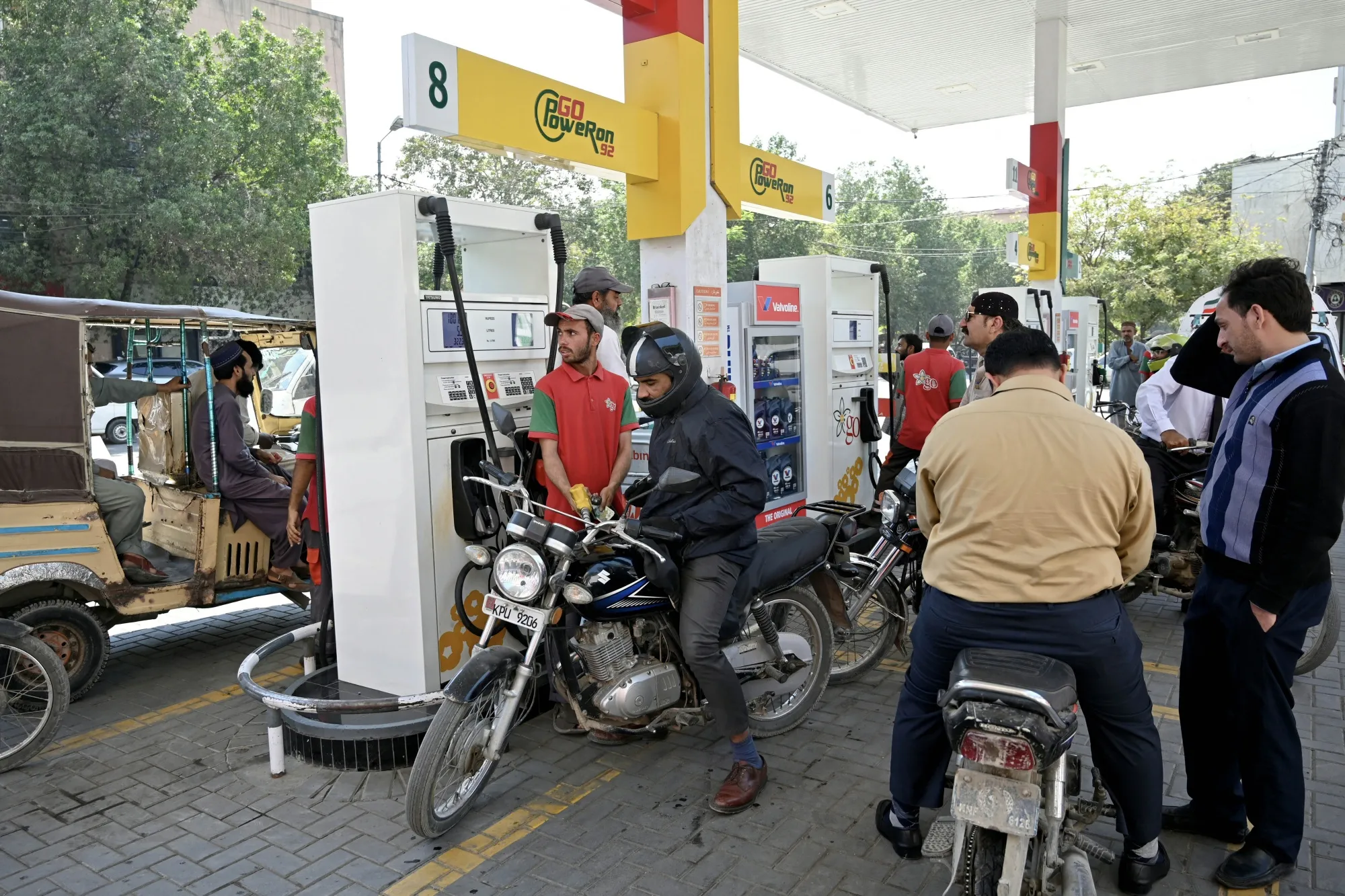 Commuters lining up at a gas station in Karachi on March 9.