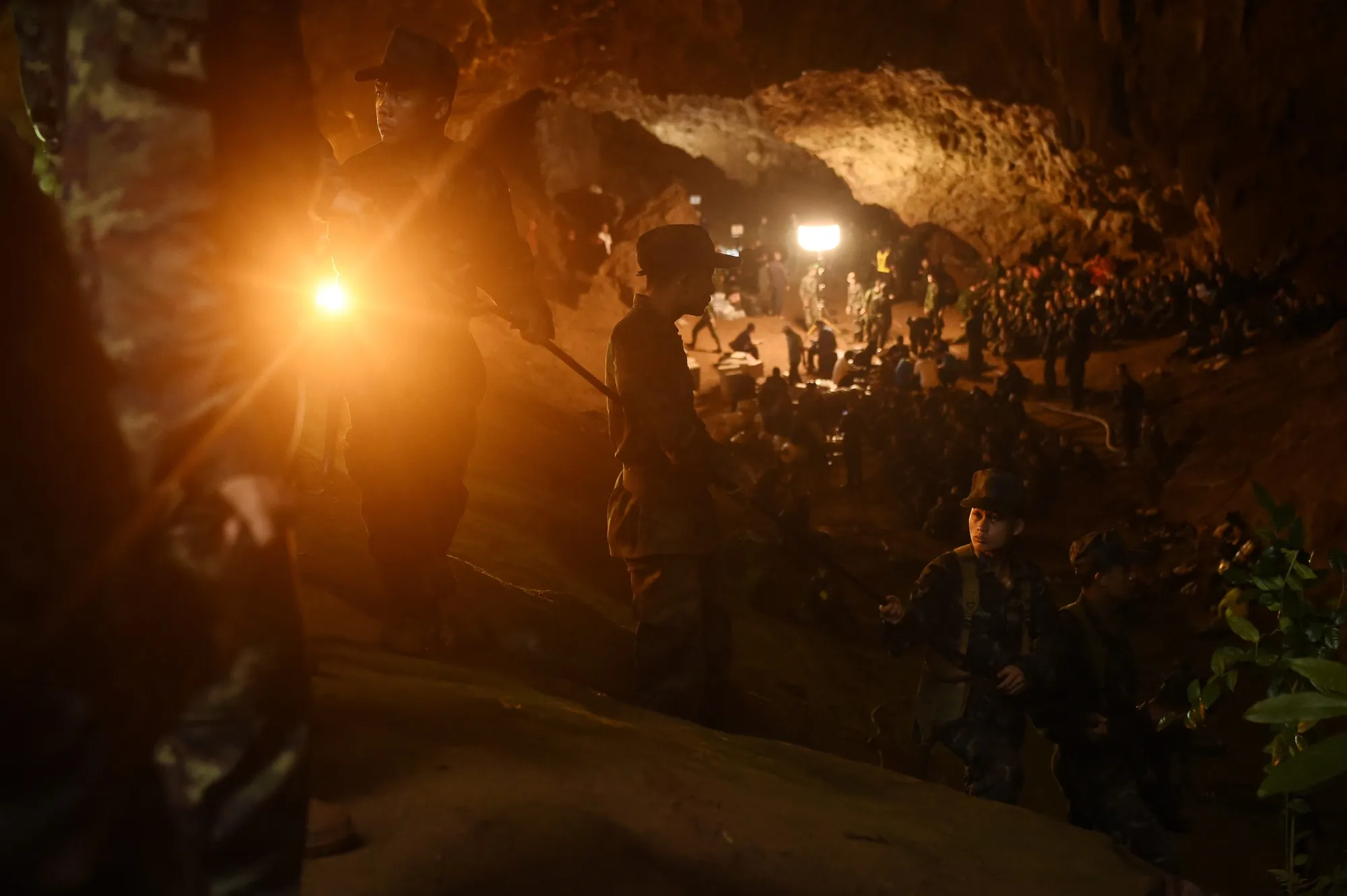 Thai soldiers relay electric cable in the Tham Luang cave in Chiang Rai on June 26, 2018.